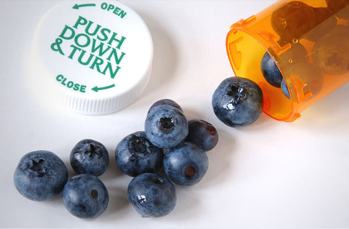 Blueberries in a pill bottle