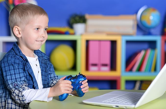 Young boy playing video game 