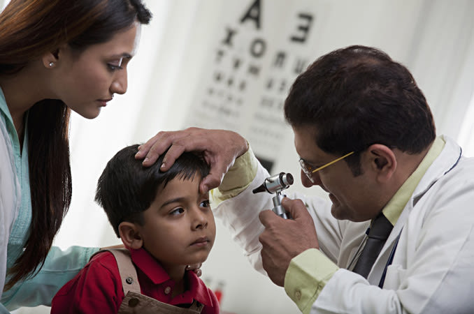 Young Indian boy getting an eye exam 