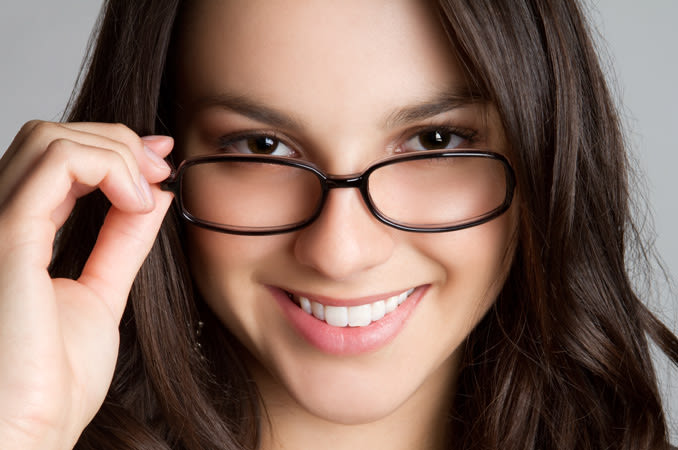 A young woman wearing eyeglasses - India