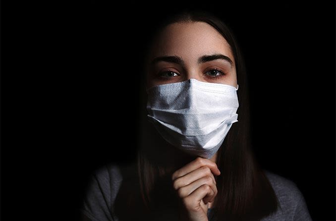 woman wearing surgical mask