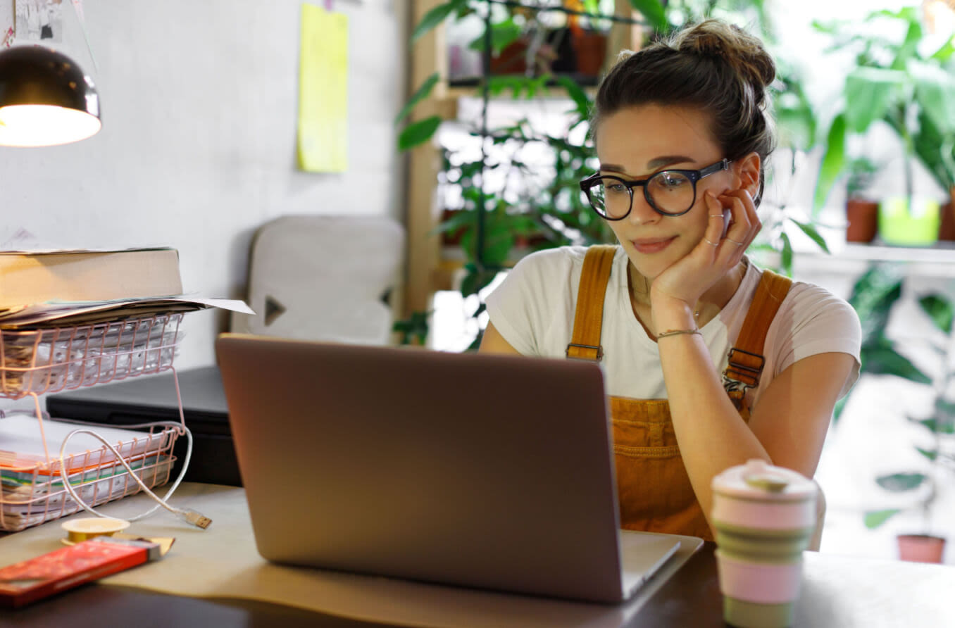 man wearing glasses at computer