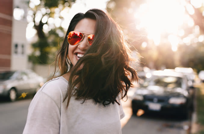 Woman wearing spf protection sunglasses