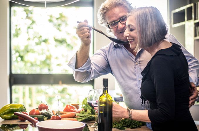 Man and woman cooking together